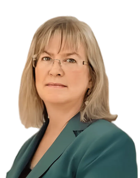 A woman with straight shoulder-length blonde hair, glasses, and a teal blazer, looking slightly to the side against a plain white background.