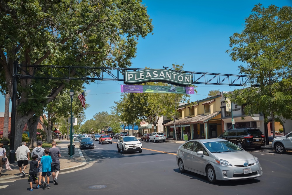 A sign above the road that reads Pleasanton
